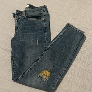 Gap true skinny distressed jeans.  Gold tone ripped threads.